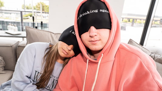 man and woman wearing hangover caps